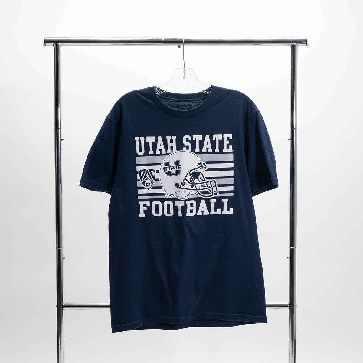 navy utah state pac-12 football t-shirt hanging on clothing rack